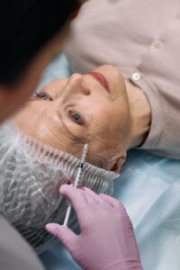 Older woman receiving a dysport or botox treatment